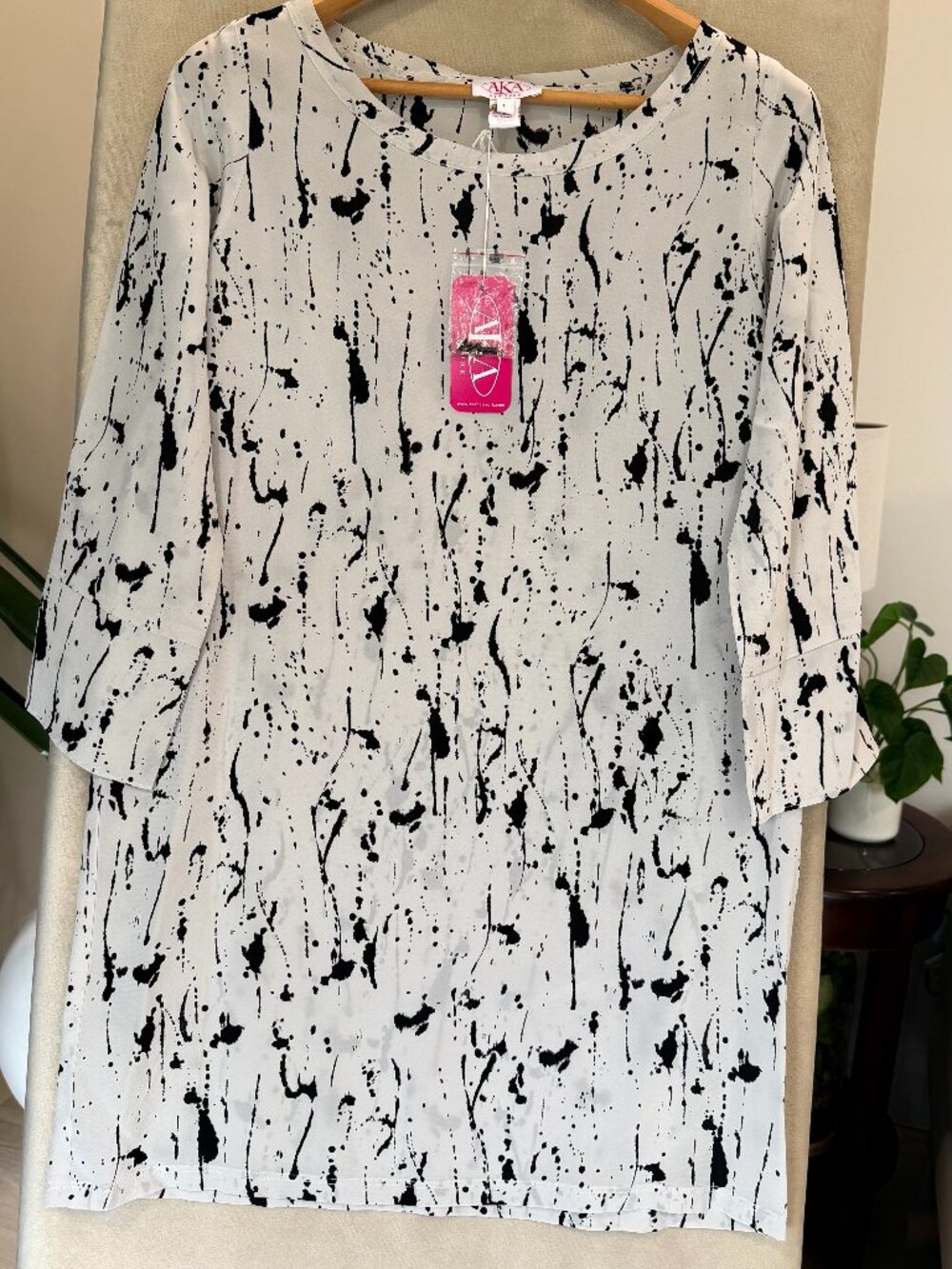 New with tags AKA New York women’s blouse in size Large.